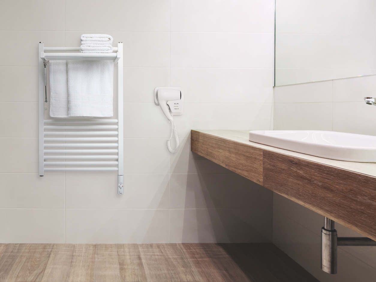 Modern public empty restroom with washstand mirror.